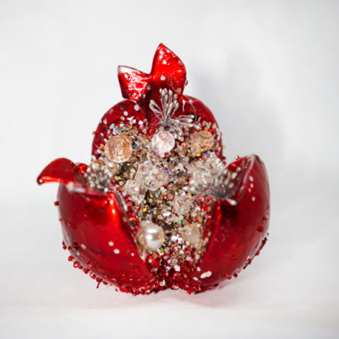 Red pomegranate with white crystals